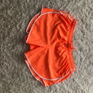 Never worn before Orange running shorts